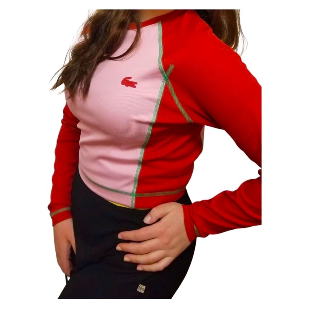 Brand new Lacoste ribbed stretched sports top. Runs more to the fitted side.